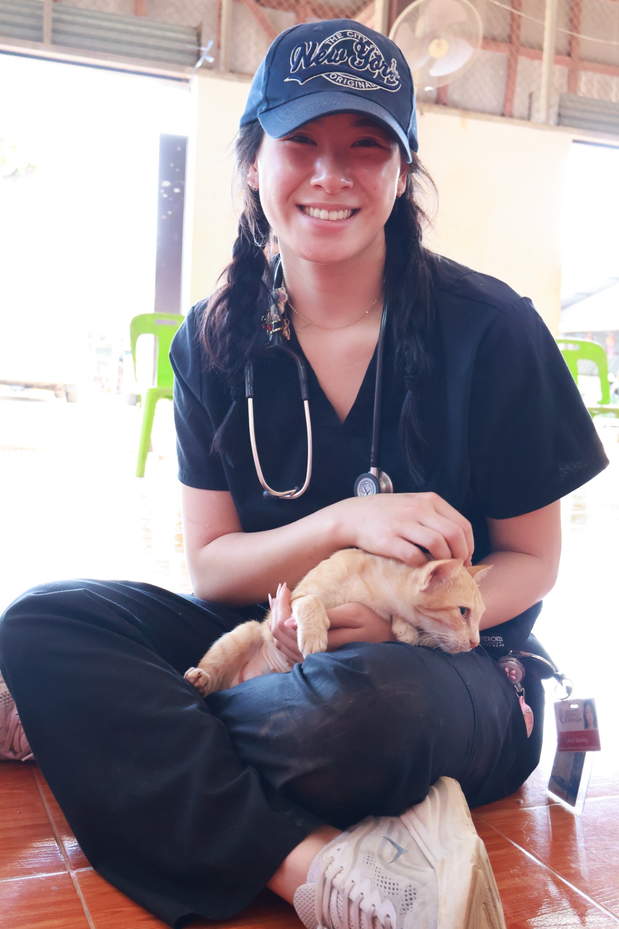 A FARVets veterinarian comforting a puppy during a field clinic